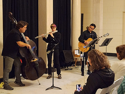 Patricia Julien with a band at the Fleming museum