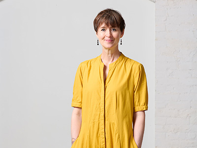 Patricia Julien in a yellow dress